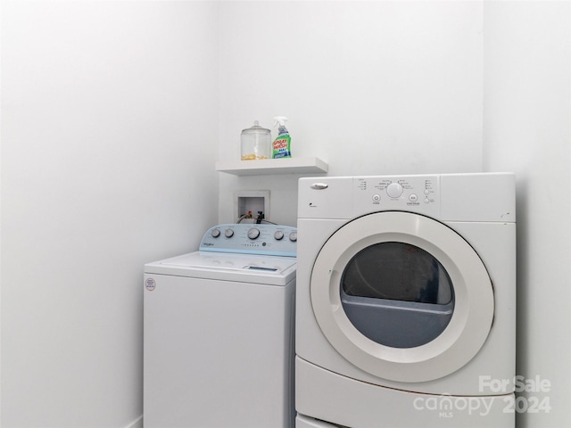 laundry room featuring washing machine and clothes dryer