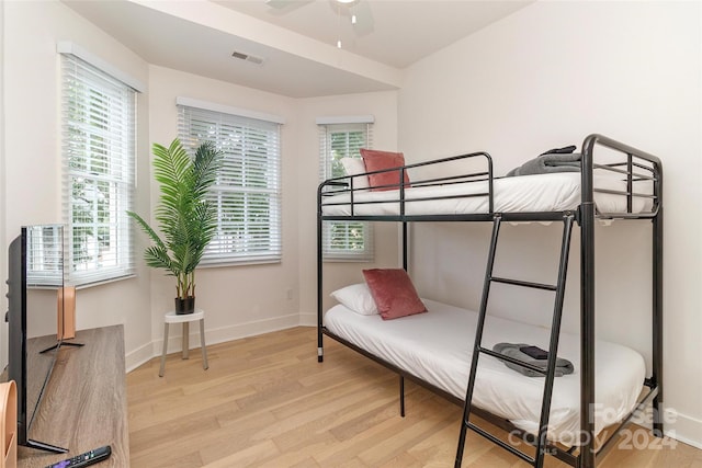 bedroom featuring ceiling fan and light hardwood / wood-style flooring