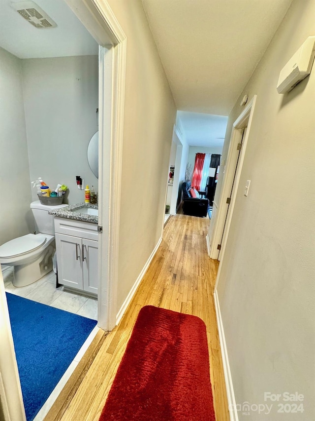 corridor featuring light hardwood / wood-style flooring