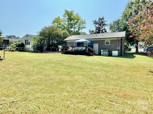 view of yard with a wooden deck