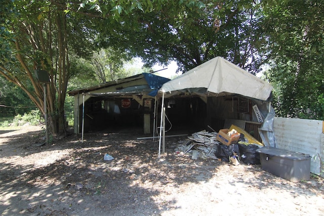 view of outbuilding with a carport