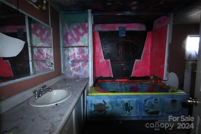 bathroom with vanity and a bathing tub