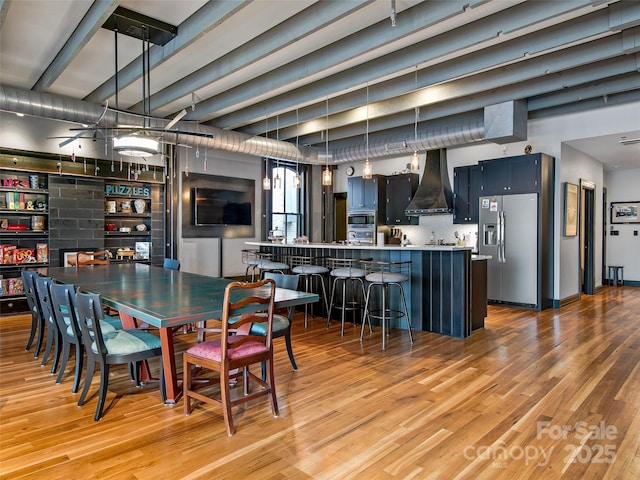 dining space with light wood-style floors