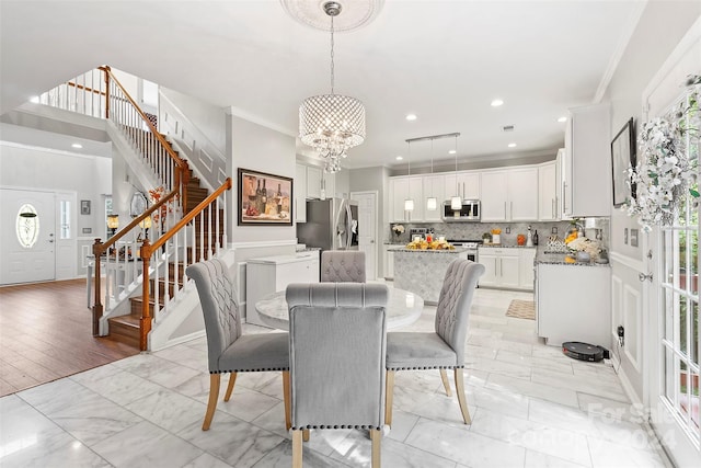 dining space with crown molding, stairs, recessed lighting, a chandelier, and marble finish floor