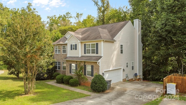 view of front of house with a garage and a front yard