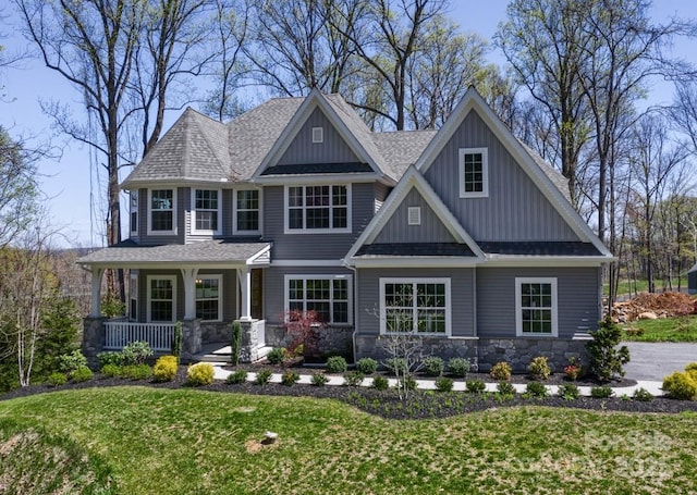 837 Lake Forest Drive Nottingham, Belmont, NC 28012 - craftsman-style home with board and batten siding, a porch, a front yard, and roof with shingles