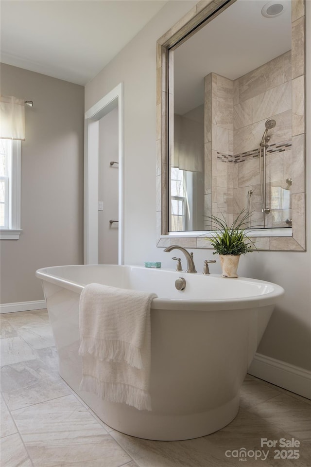 837 Lake Forest Drive Nottingham, Belmont, NC 28012 - bathroom featuring a freestanding bath and baseboards
