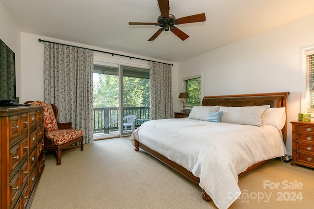 carpeted bedroom with ceiling fan and access to exterior