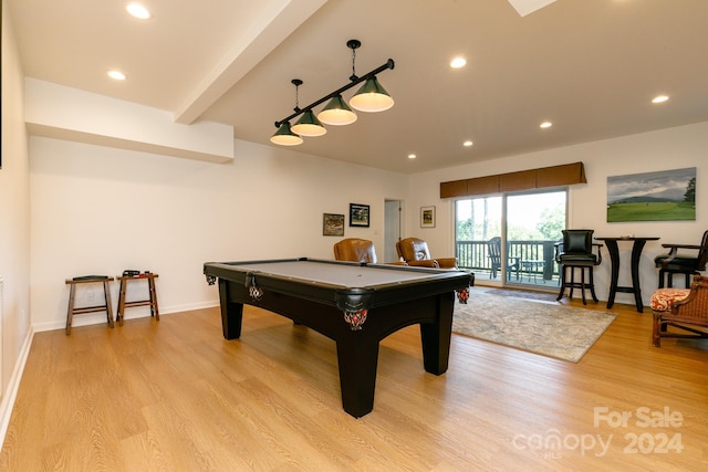 game room with pool table, beamed ceiling, and light hardwood / wood-style flooring