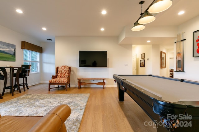 rec room with billiards and light hardwood / wood-style flooring