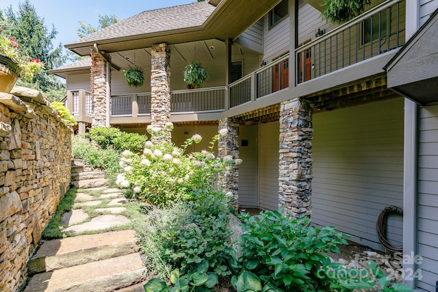 view of side of property with a balcony