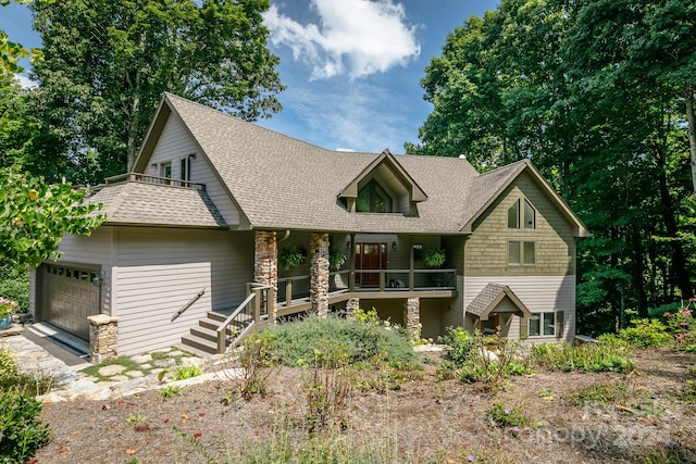 view of front of home featuring a garage and covered porch