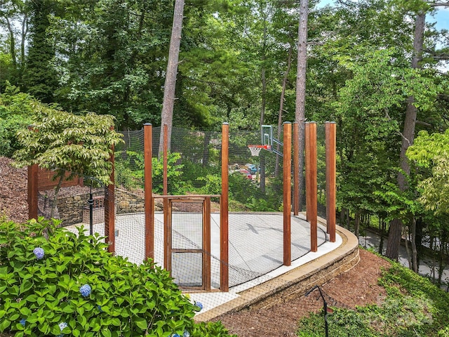 view of gate featuring fence