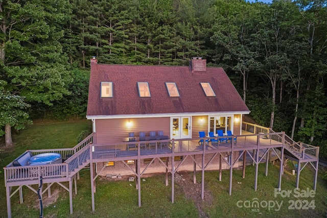 back of house with a yard and a wooden deck