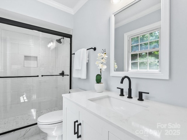 bathroom featuring toilet, crown molding, a shower with shower door, and vanity