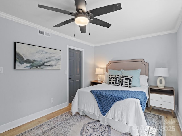 bedroom featuring light wood-type flooring, ceiling fan, and crown molding