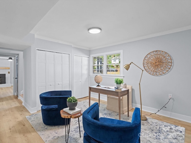 office space featuring ornamental molding and light wood-type flooring