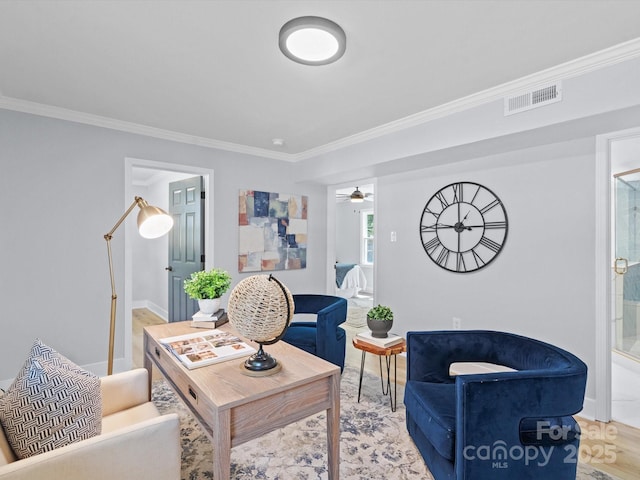 living room featuring crown molding