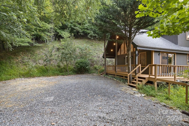 view of yard with a wooden deck