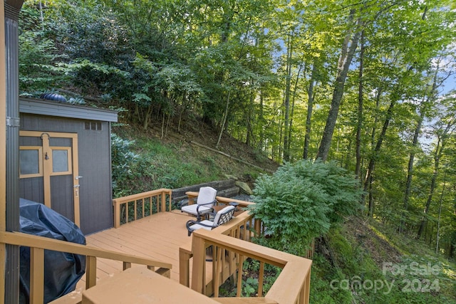 deck featuring an outbuilding and grilling area