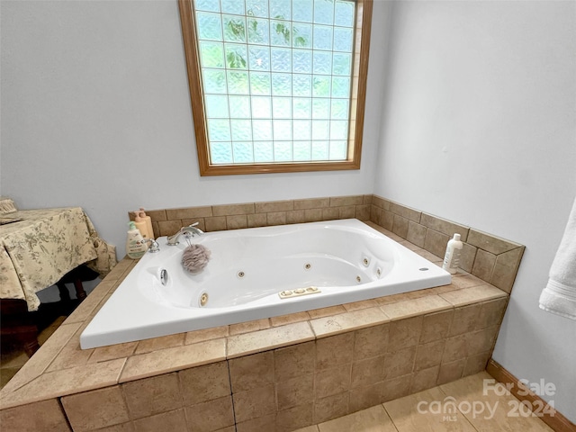 bathroom featuring tiled bath and tile patterned floors