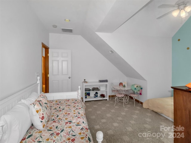 carpeted bedroom featuring lofted ceiling and ceiling fan