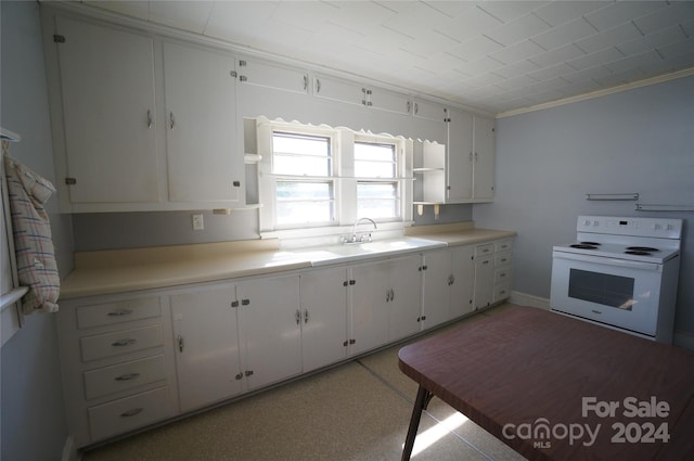 kitchen featuring crown molding, white cabinetry, sink, and electric range