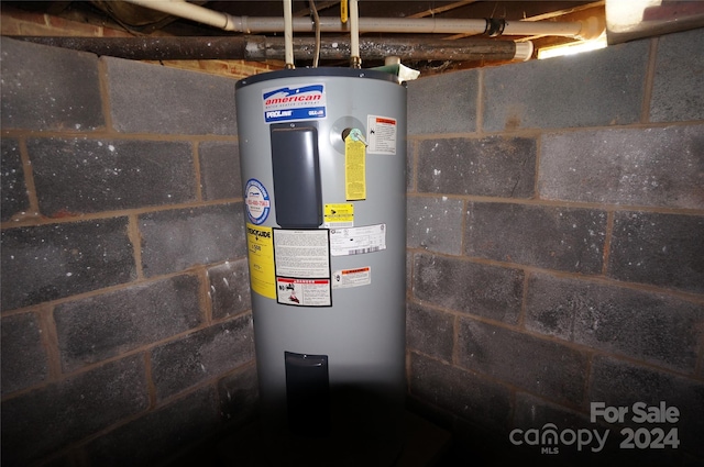 utility room with electric water heater