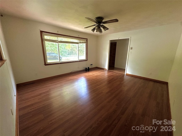 interior space with ceiling fan, baseboards, and wood finished floors