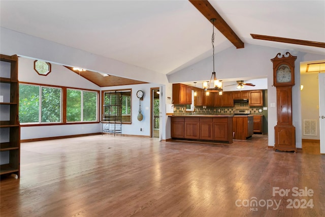 unfurnished living room with ceiling fan with notable chandelier, beam ceiling, sink, high vaulted ceiling, and hardwood / wood-style flooring