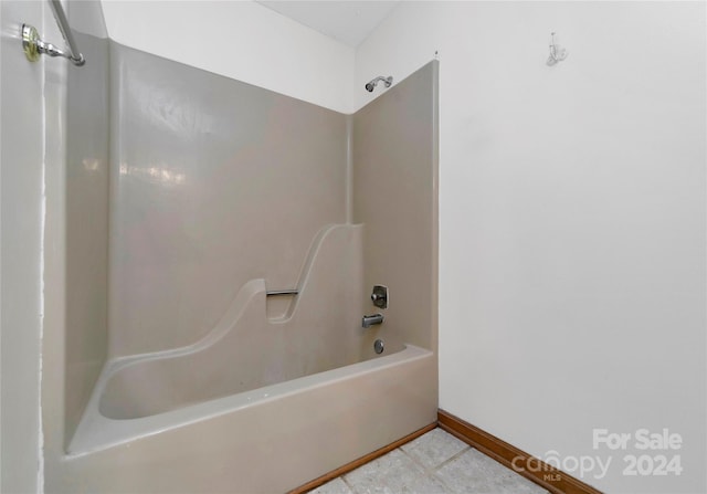 bathroom featuring shower / tub combination and tile patterned floors