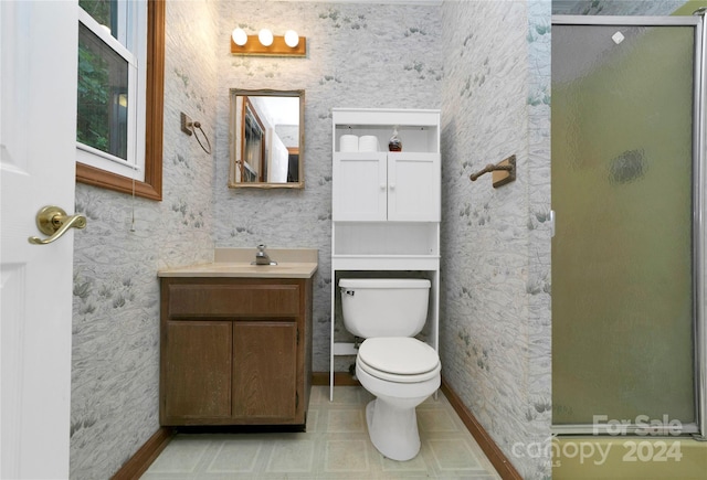 bathroom with vanity, toilet, an enclosed shower, and tile patterned flooring