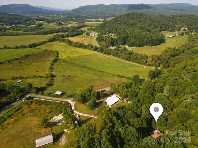 bird's eye view featuring a rural view and a mountain view