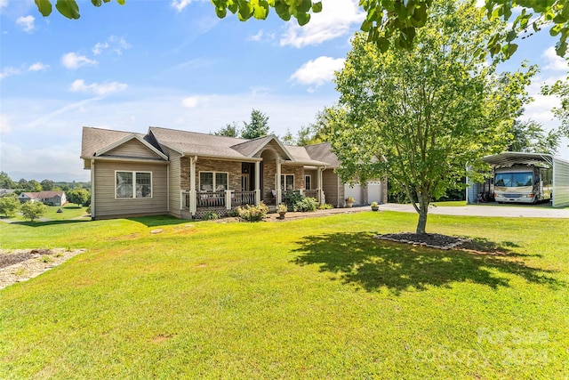 single story home featuring a front lawn, a carport, covered porch, and a garage