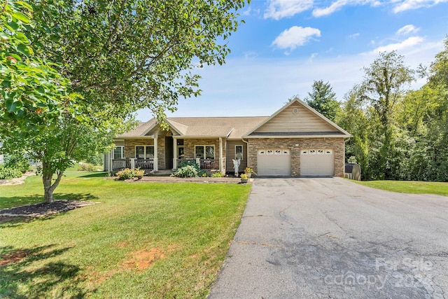 ranch-style home featuring a garage, a porch, and a front lawn