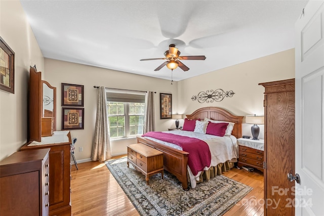 bedroom featuring light wood-type flooring and ceiling fan