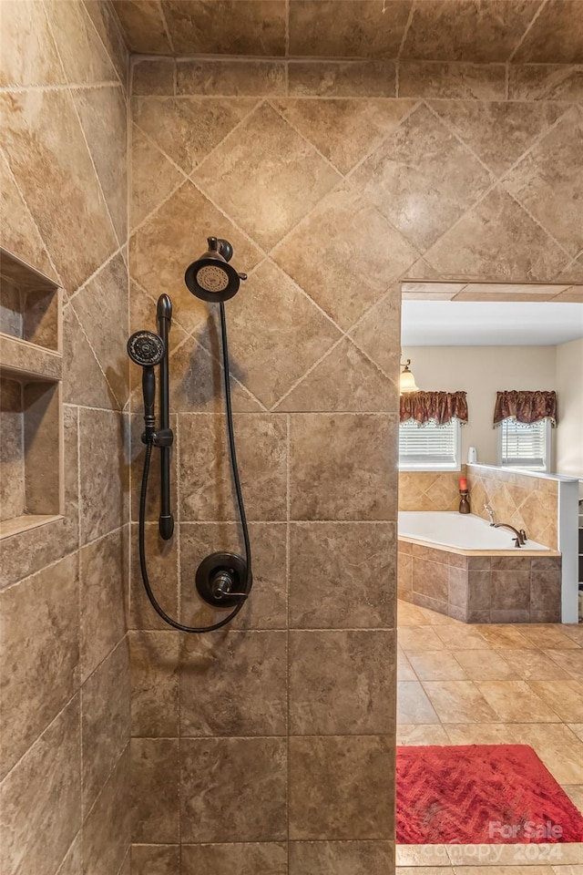 bathroom featuring separate shower and tub and tile patterned flooring