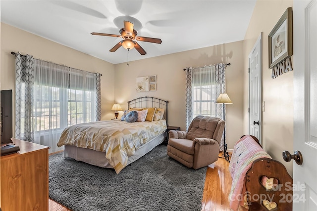 bedroom featuring ceiling fan and hardwood / wood-style floors