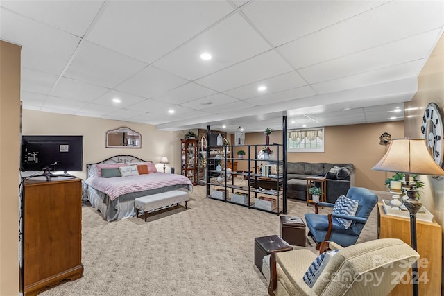 bedroom featuring a paneled ceiling and carpet flooring