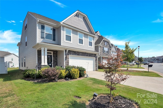 view of front facade with a front yard and a garage