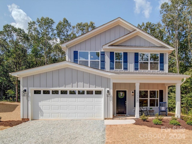 view of front of property with a garage and covered porch