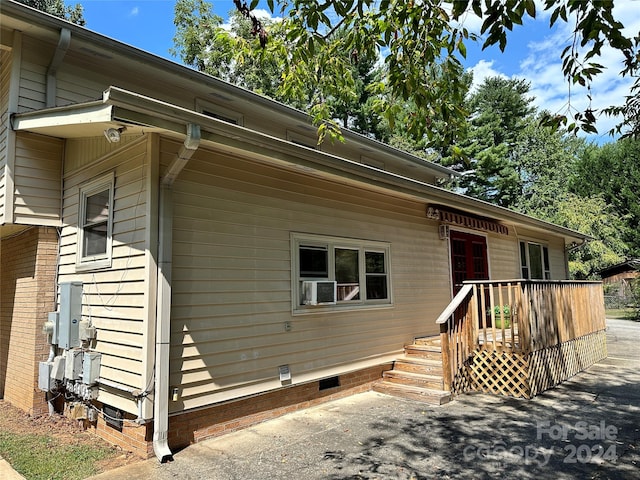 view of front of house with a wooden deck