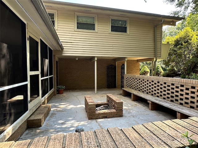 exterior space featuring a fire pit and a patio area