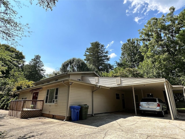 view of side of home featuring a carport