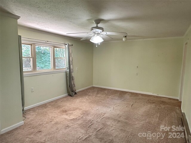 unfurnished room featuring ceiling fan, carpet floors, and a textured ceiling