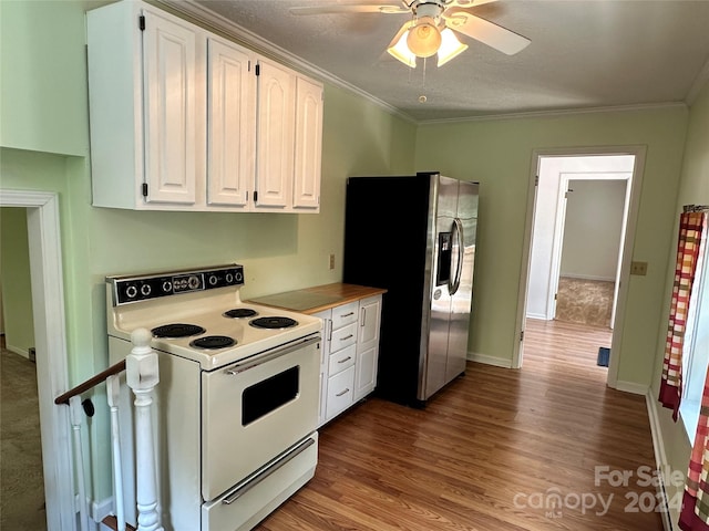 kitchen with ornamental molding, stainless steel fridge, ceiling fan, white electric range oven, and white cabinets