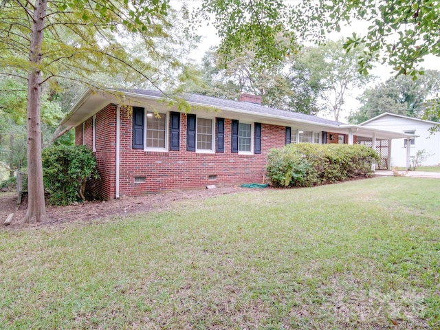 view of front facade featuring crawl space, a front yard, brick siding, and a chimney