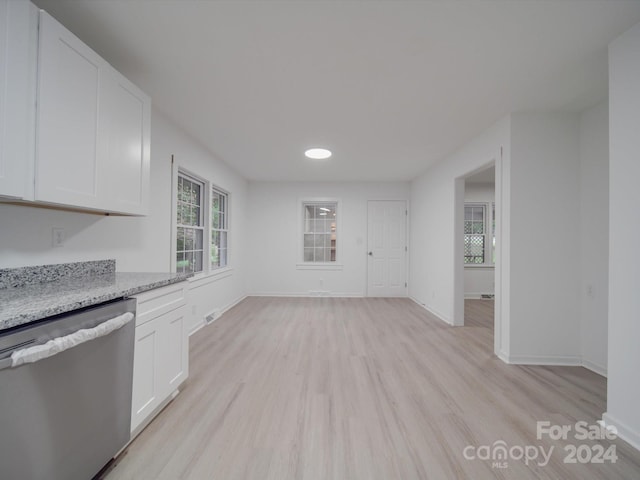 kitchen with dishwasher, light wood-type flooring, white cabinetry, and light stone countertops