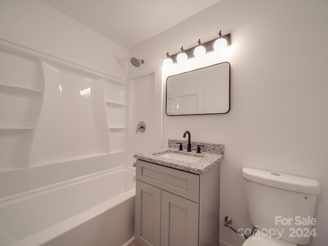 bathroom featuring vanity, toilet, and shower / tub combination