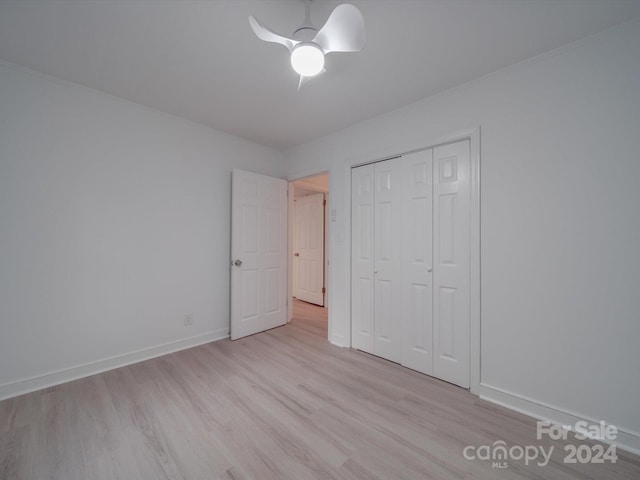 unfurnished bedroom featuring a closet, ceiling fan, and light hardwood / wood-style floors